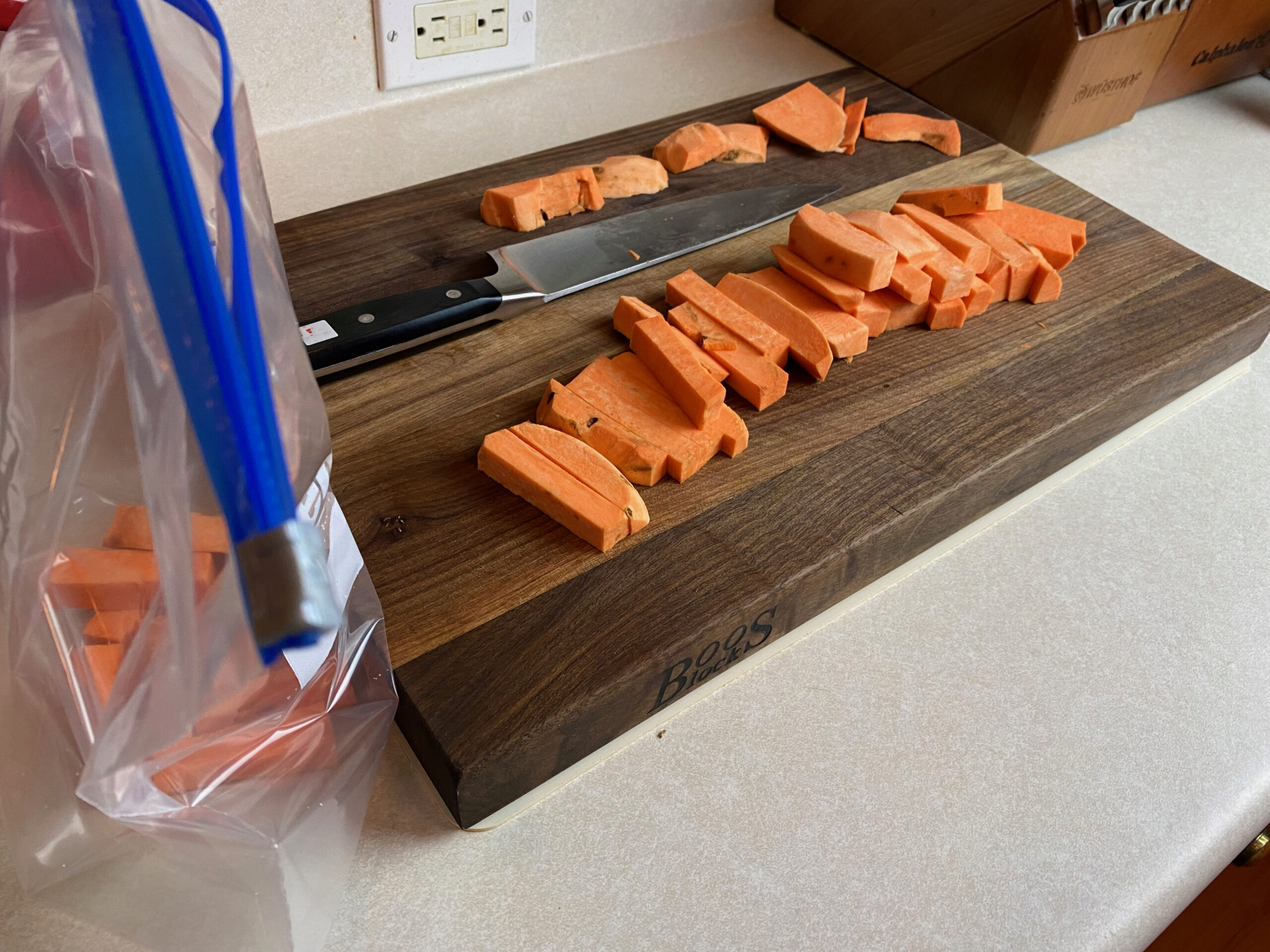 uncooked sweet potato fries on a cutting board 2 