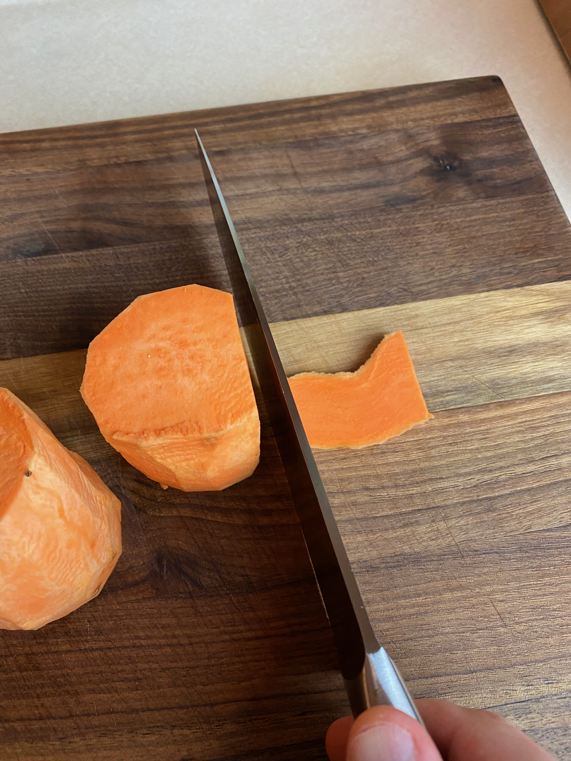 slicing a sweet potato