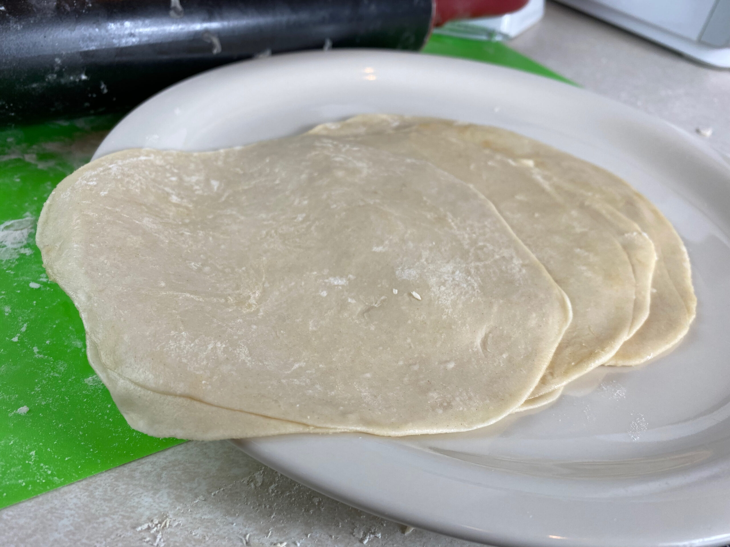 flattened uncooked mandarin pancakes, stacked together