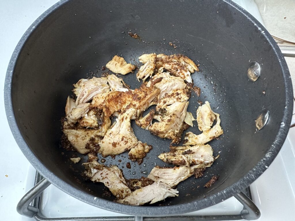 Chicken with spices in the pan