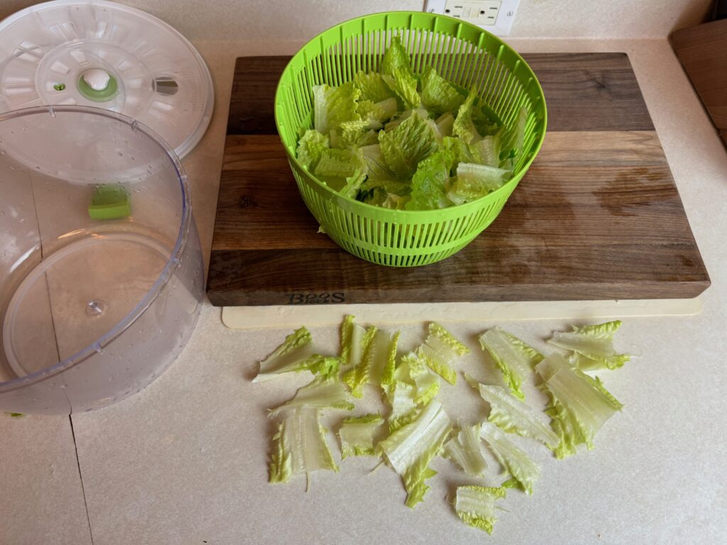 some less desirable pieces of lettuce are thrown away for my Caesar salad made from scratch recipe